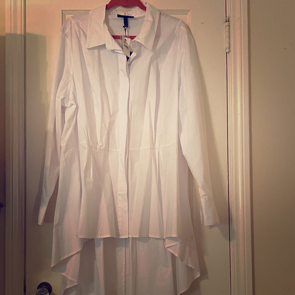 White hi-low blouse with hidden buttons.